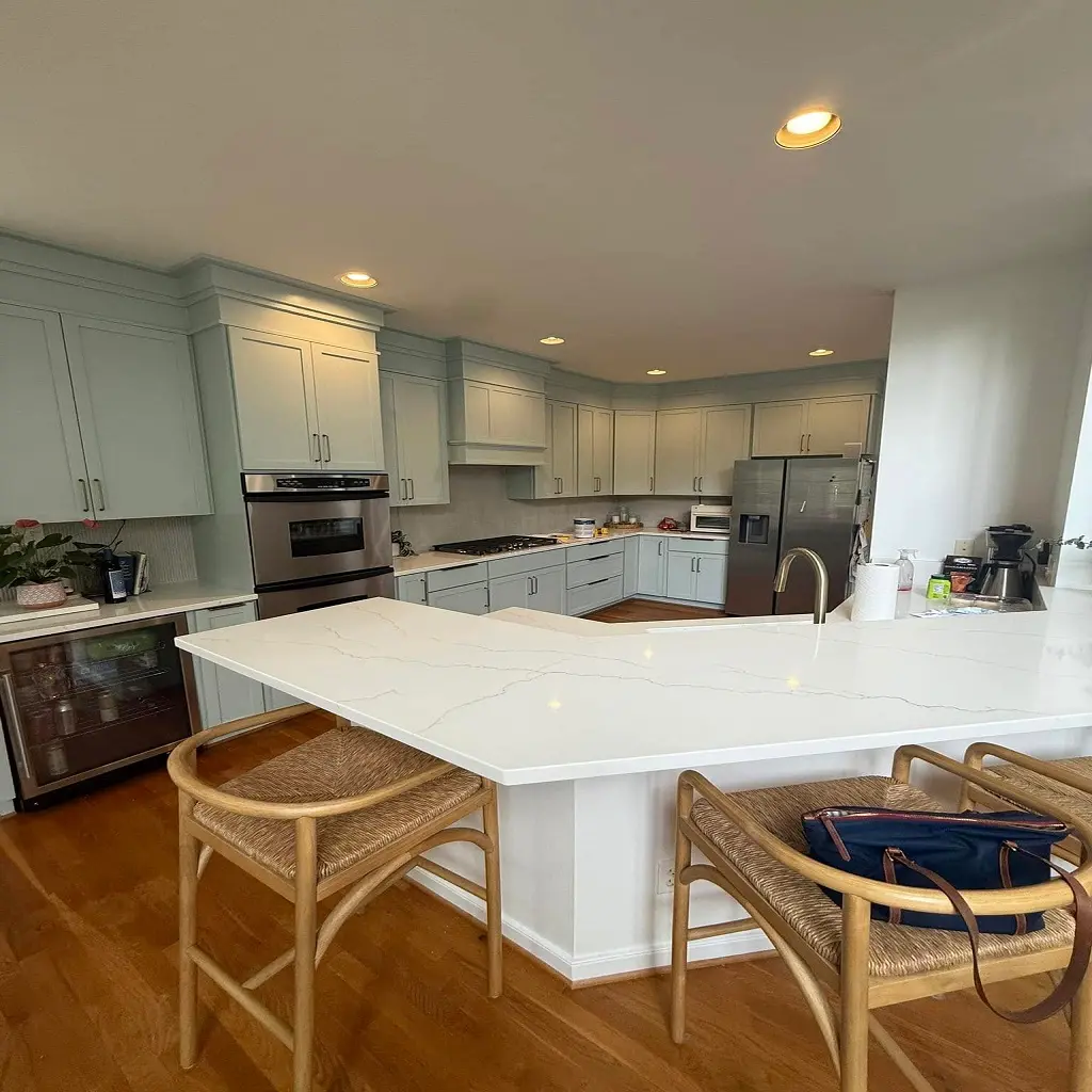 Refinished kitchen cabinets with painted finish and marble countertops in Tuckahoe